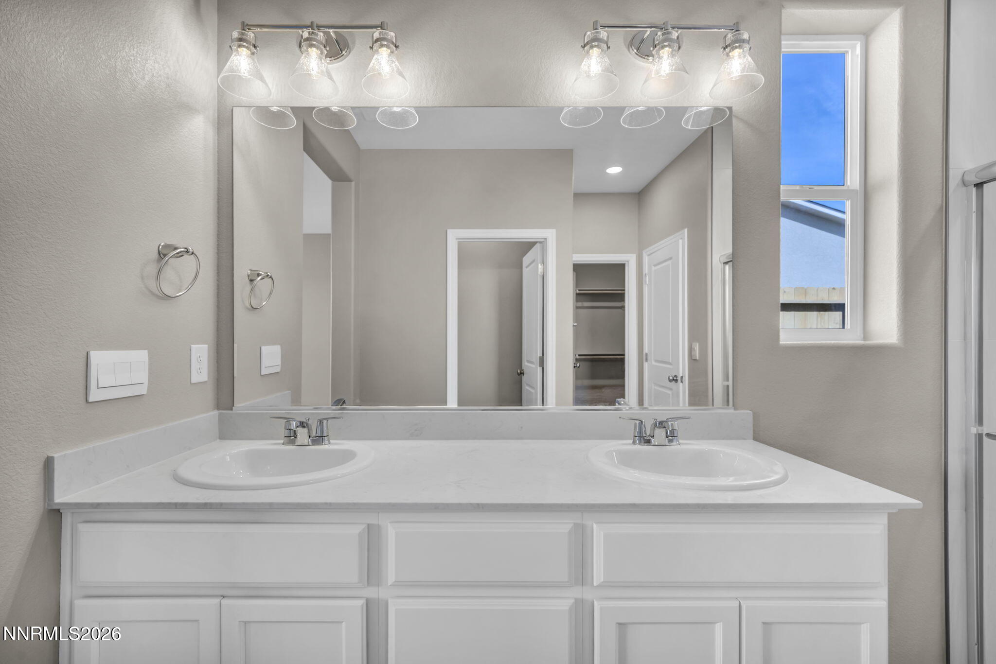 6668 Morgan Mill Road, Unit HOMESITE 15 Carson City, NV 89701 - Photo 16 of 25 a bathroom with a sink double vanity and a mirror