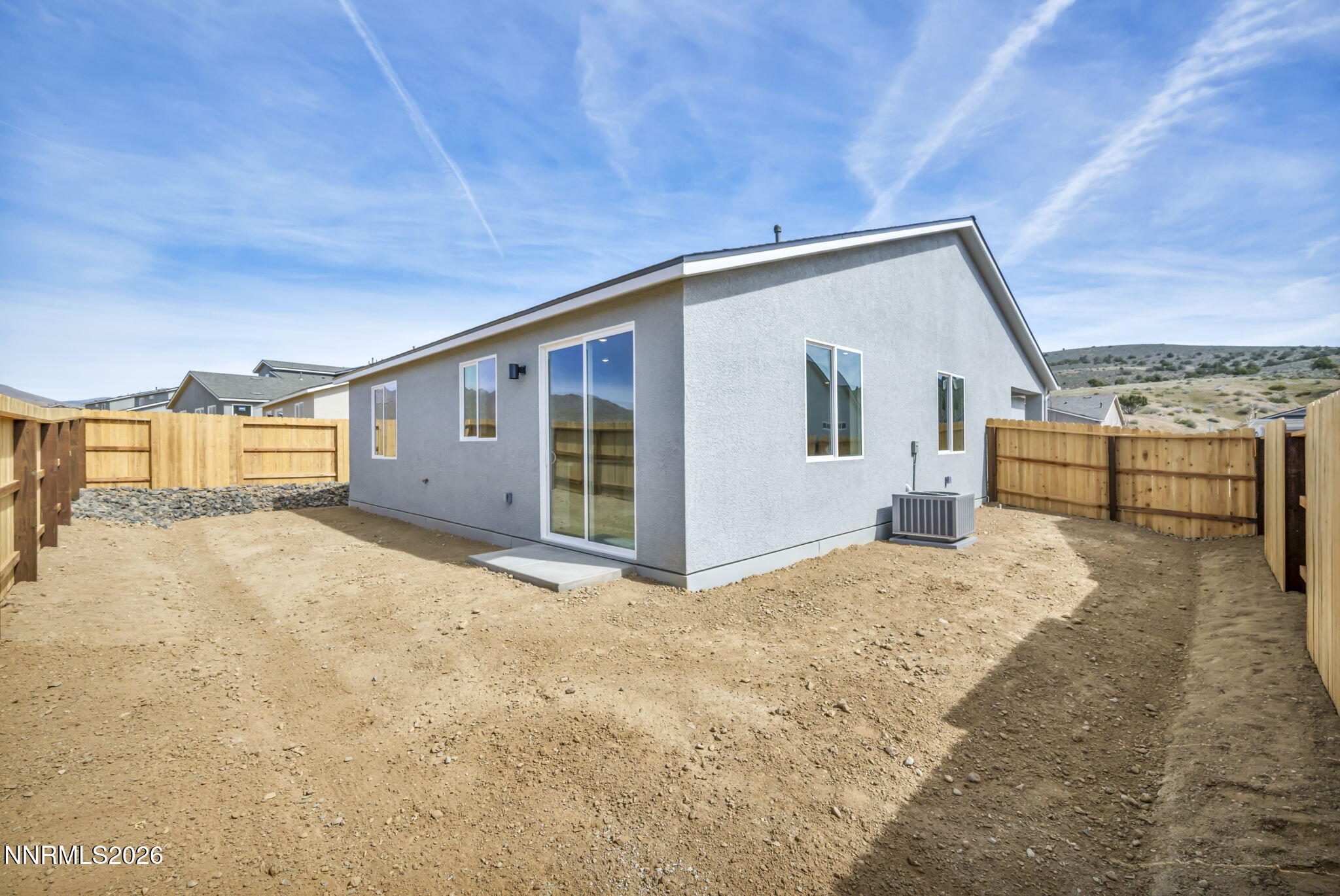 6668 Morgan Mill Road, Unit HOMESITE 15 Carson City, NV 89701 - Photo 21 of 25 a view of a house with a snow in the background