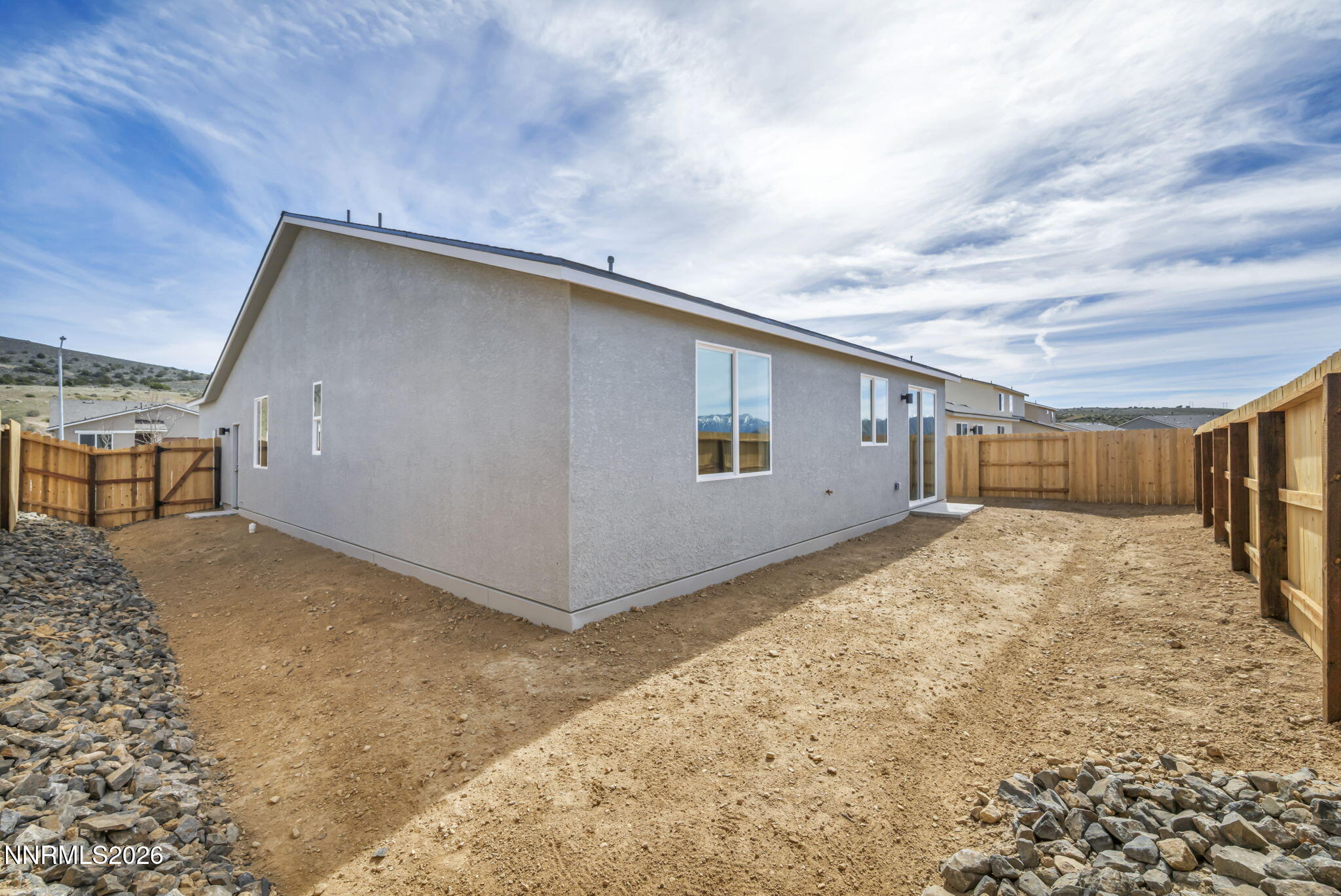 6668 Morgan Mill Road, Unit HOMESITE 15 Carson City, NV 89701 - Photo 22 of 25 a backyard of a house