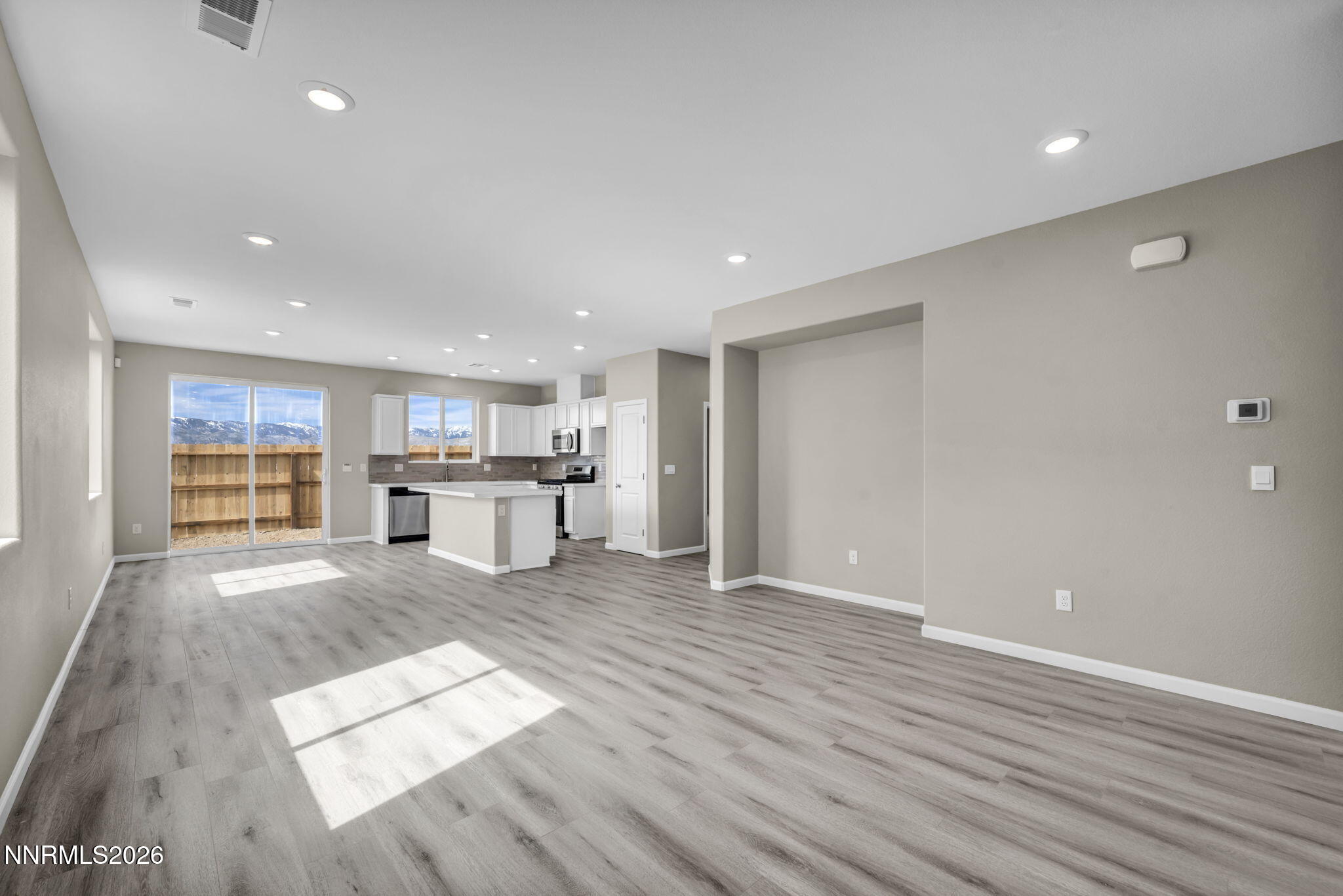 6668 Morgan Mill Road, Unit HOMESITE 15 Carson City, NV 89701 - Photo 7 of 25 a big room with wooden floor and windows