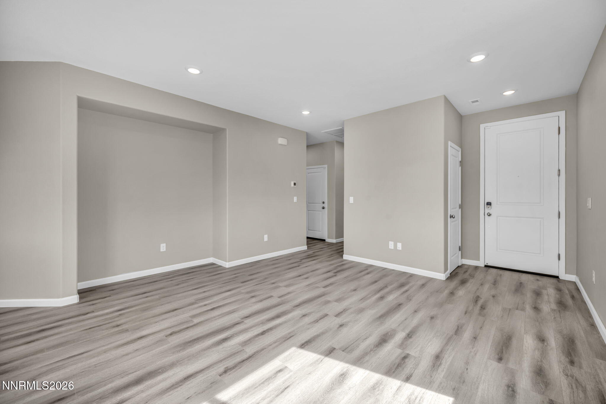 6668 Morgan Mill Road, Unit HOMESITE 15 Carson City, NV 89701 - Photo 8 of 25 a view of an empty room with wooden floor