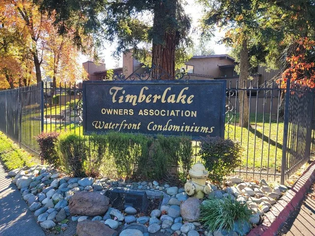 a view of outdoor space with signage and flags