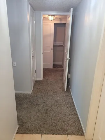 a view of empty room with floor to ceiling window