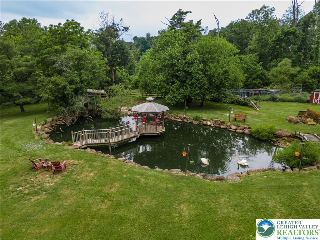 2485 Hieter Road Quakertown, PA 18951 - Photo 76 of 97 Discover a tranquil pond with a charming gazebo, perfect for serene outdoor moments.