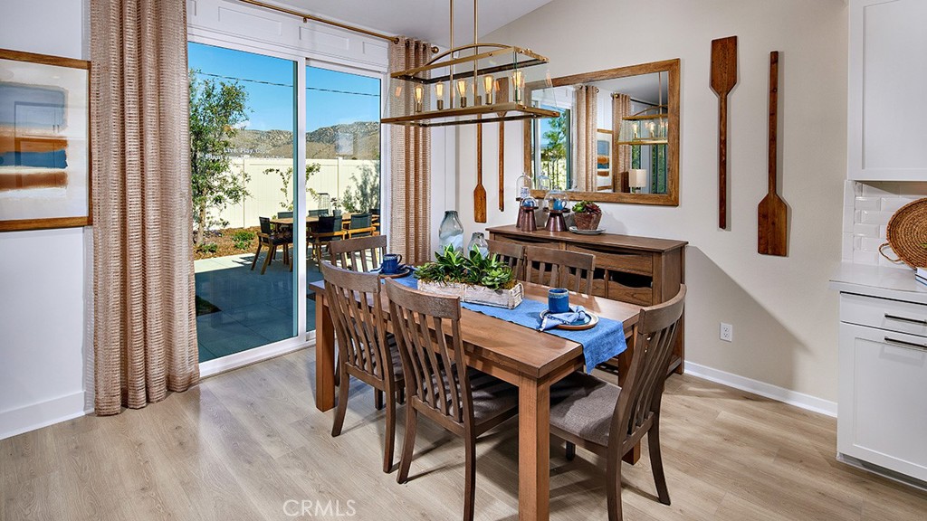 32480 Boseman Trail Winchester, CA 92596 - Photo 4 of 10 a dining room with furniture a chandelier and wooden floor