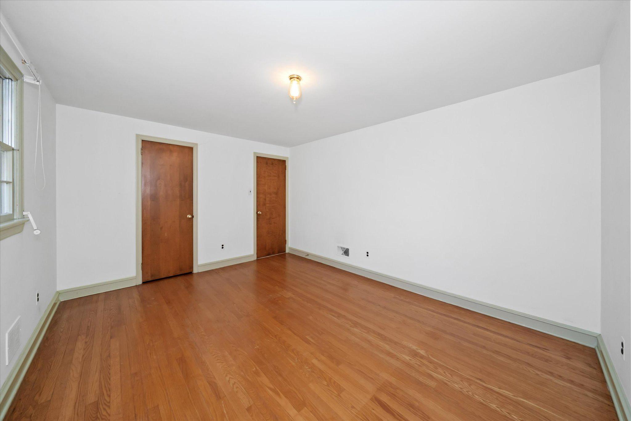 859 Yorklyn Road Hockessin, DE 19707 - Photo 13 of 28 First floor bedroom with warm wood floors.