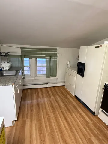 a spacious bathroom with a large tub sink and vanity