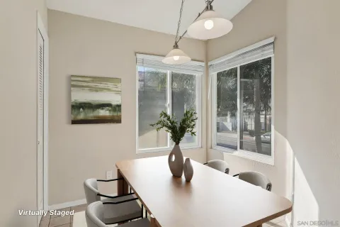 a dining room with furniture and window