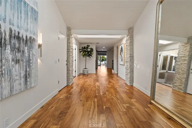 a view of a house with swimming pool and sitting area