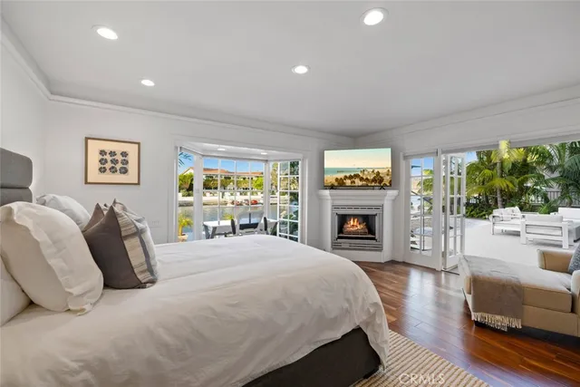 a spacious bedroom with a bed and couch