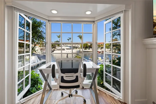 a bedroom with a bed couch and a window