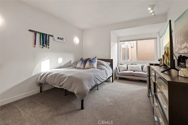 a living room with fireplace furniture and a large window