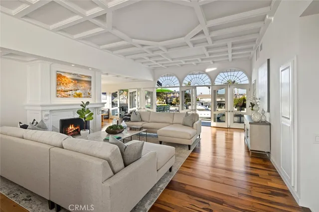 a spacious bedroom with a bed a couch and a flat screen tv