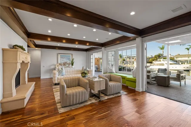 a kitchen with stainless steel appliances granite countertop a sink a stove and a wooden floors