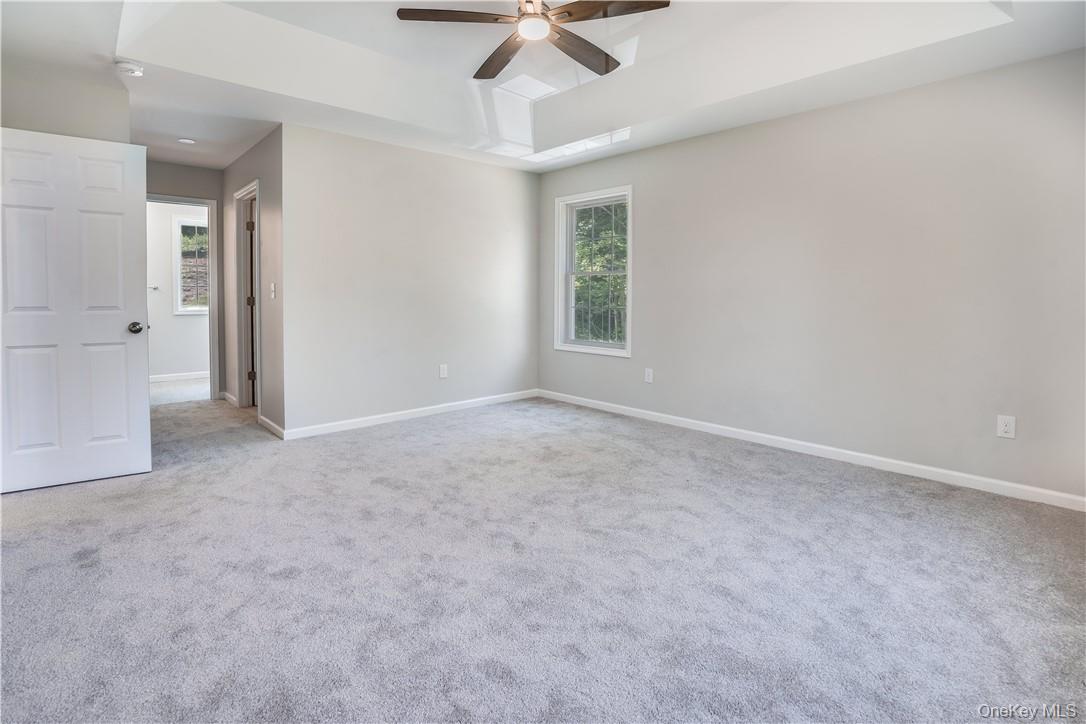 Lot 1 Hillside Lake Road Wappingers Falls, NY 12590 - Photo 8 of 20 en empty room with windows and ceiling fan