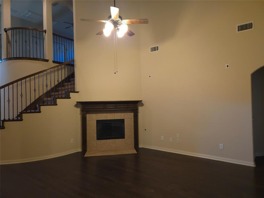 9316 Turtle Pass Fort Worth, TX 76177 - Photo 18 of 38 a view of an empty room with wooden floor and a window