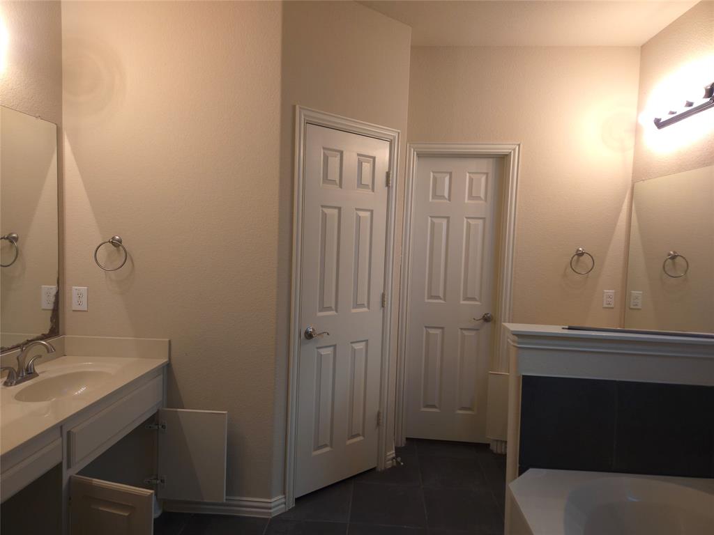 9316 Turtle Pass Fort Worth, TX 76177 - Photo 24 of 38 a bathroom with a sink a toilet and shower