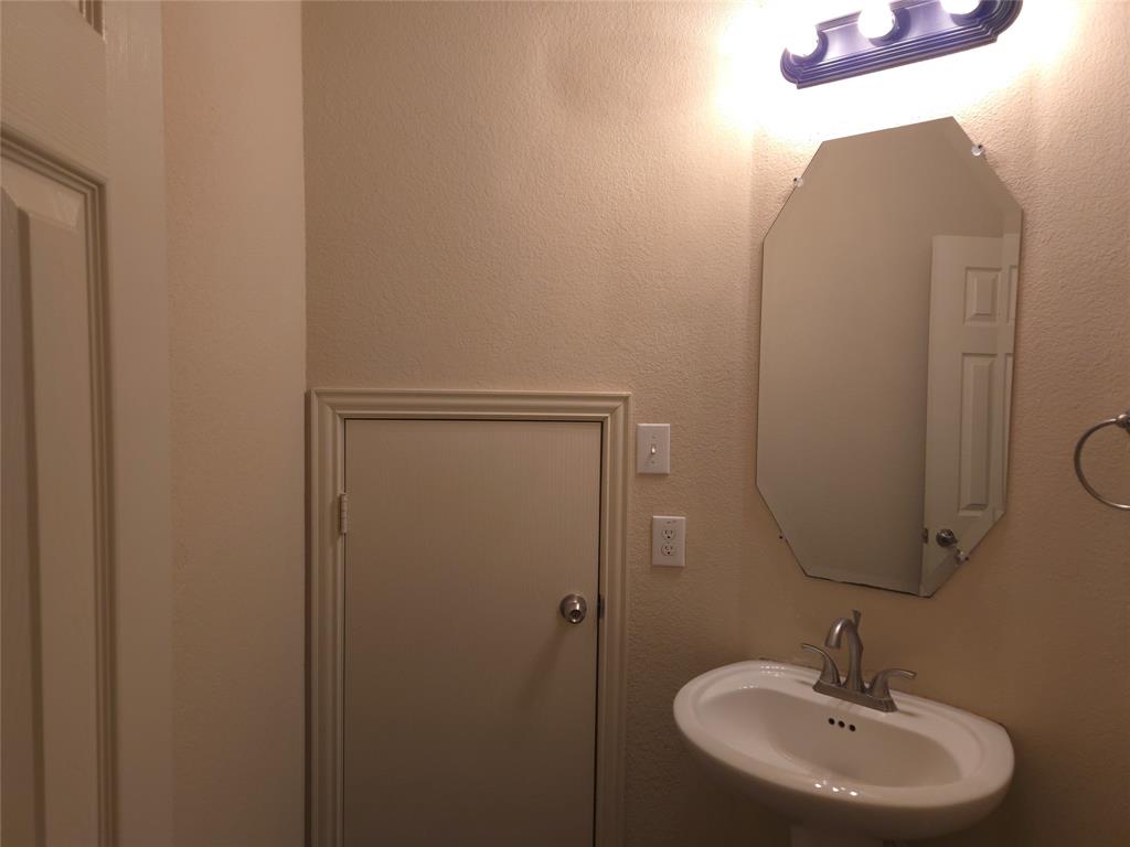 9316 Turtle Pass Fort Worth, TX 76177 - Photo 9 of 38 a bathroom with a sink and a mirror