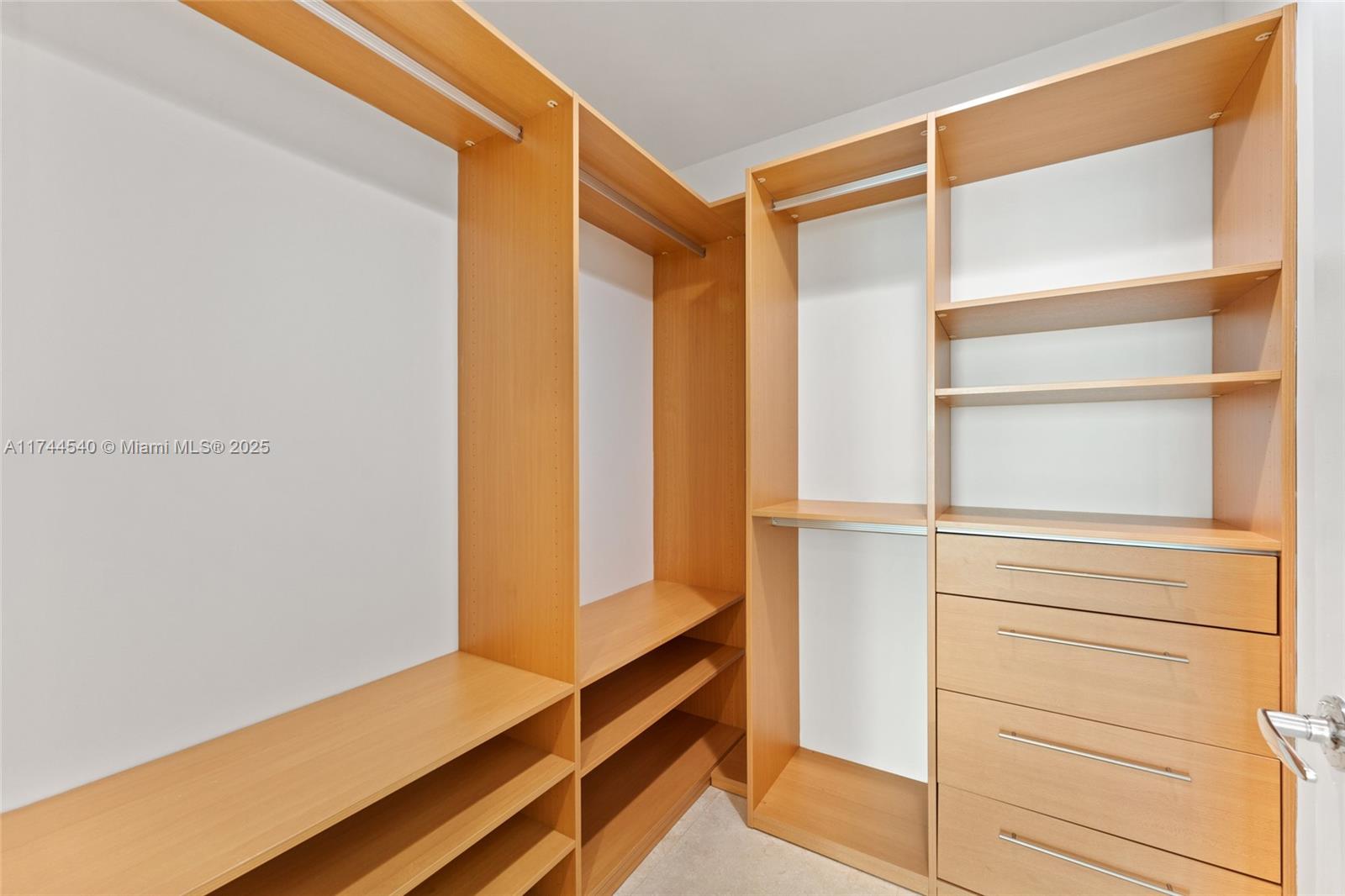 900 Biscayne Boulevard, Unit 4708 Miami, FL 33132 - Photo 13 of 39 a view of walk in closet with empty racks