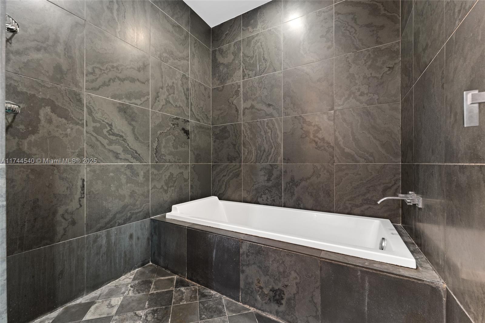 900 Biscayne Boulevard, Unit 4708 Miami, FL 33132 - Photo 15 of 39 a bathroom with a bathtub