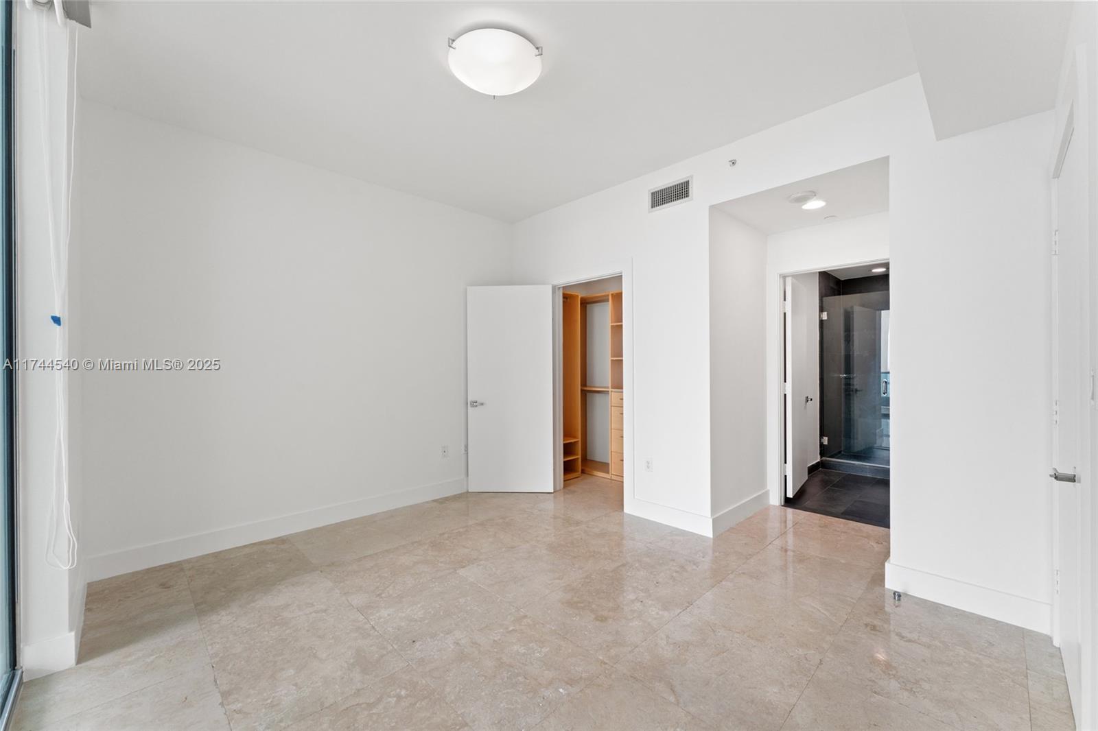 900 Biscayne Boulevard, Unit 4708 Miami, FL 33132 - Photo 16 of 39 a view of an empty room and closet