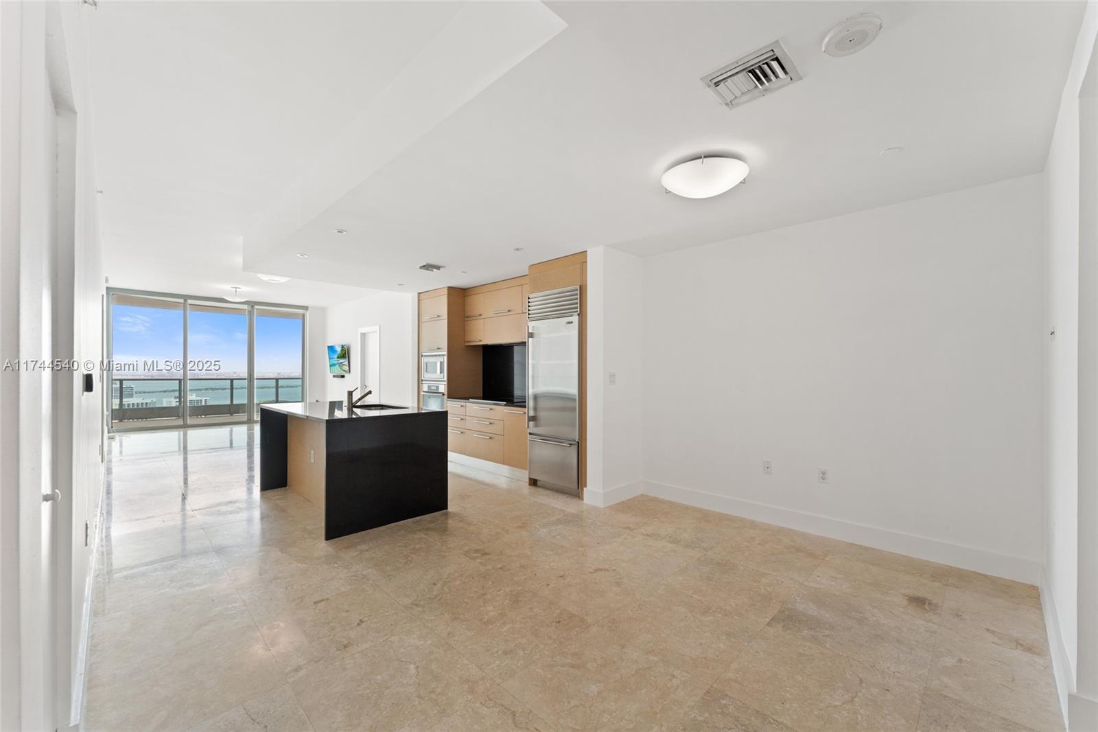 900 Biscayne Boulevard, Unit 4708 Miami, FL 33132 - Photo 2 of 39 a large white kitchen with a large window