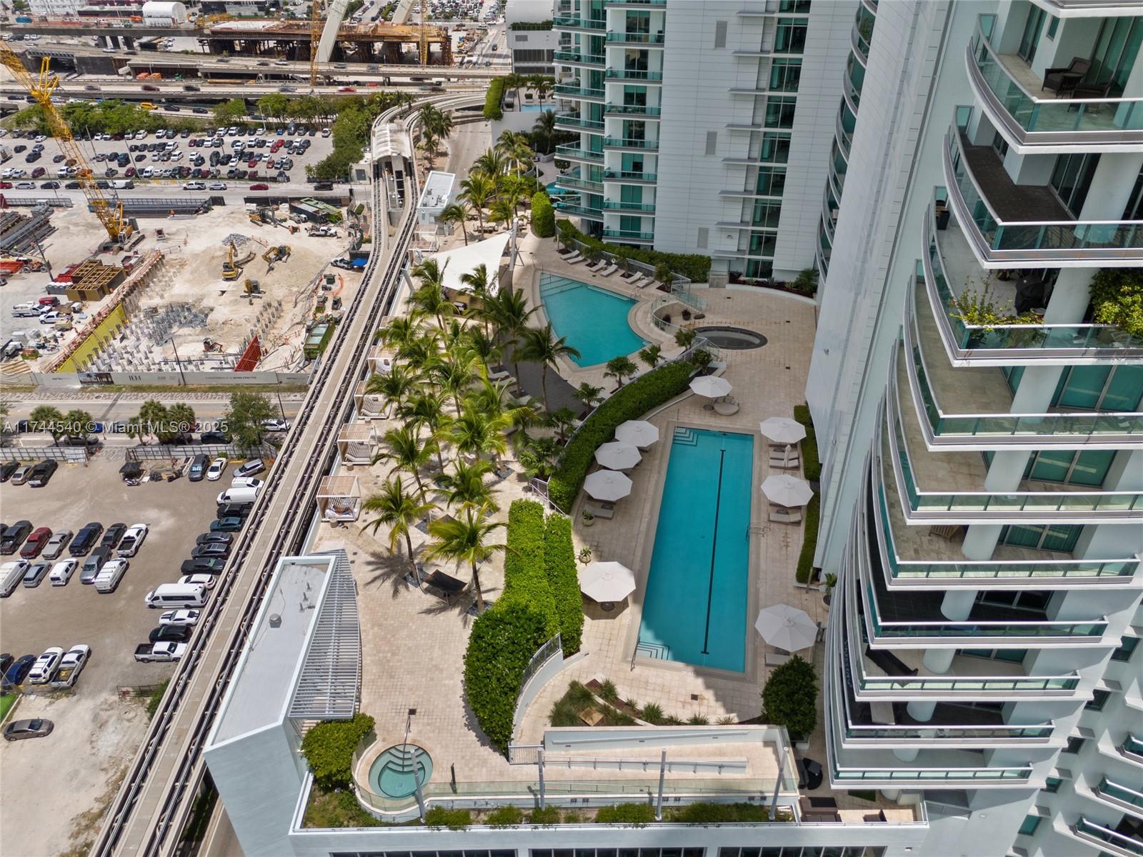 900 Biscayne Boulevard, Unit 4708 Miami, FL 33132 - Photo 27 of 39 an aerial view of a residential apartment building with a yard