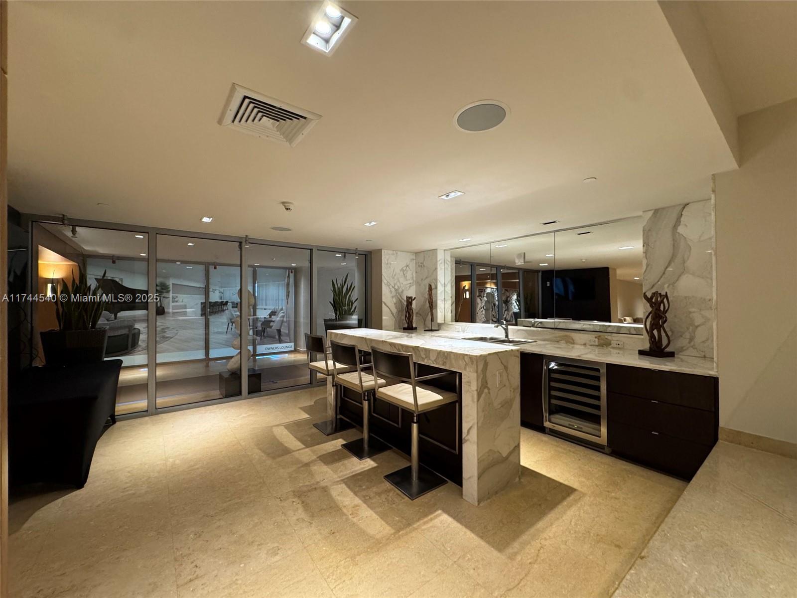 900 Biscayne Boulevard, Unit 4708 Miami, FL 33132 - Photo 37 of 39 a kitchen with a sink and counter top space