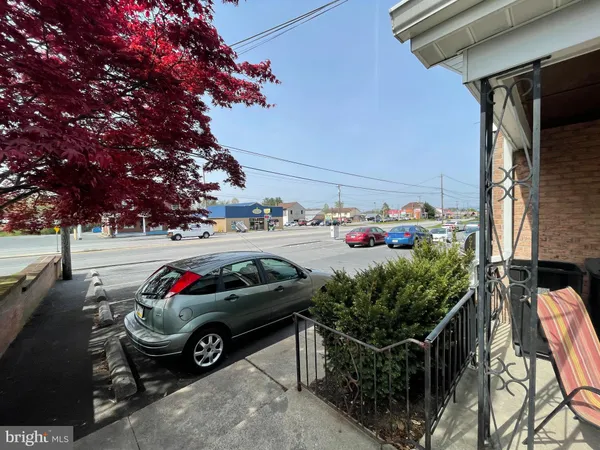 a view of garage with cars parked