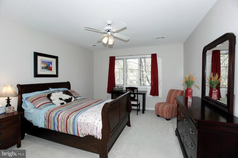 2252 Cedar Cove Court Reston, VA 20191 - Photo 1 of 26 a bedroom with a bed couch and window