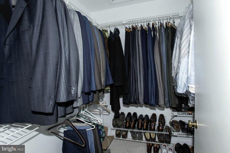 2252 Cedar Cove Court Reston, VA 20191 - Photo 14 of 26 a view of walk in closet with clothes and shoes