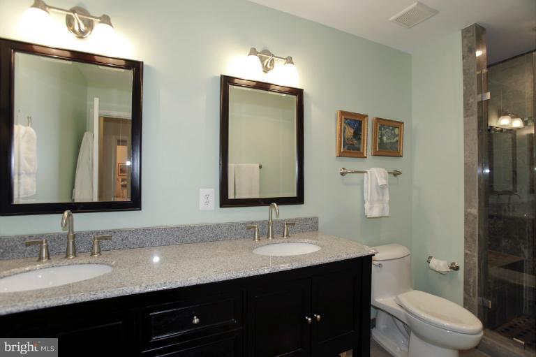 2252 Cedar Cove Court Reston, VA 20191 - Photo 15 of 26 a bathroom with 2 sink and a mirror