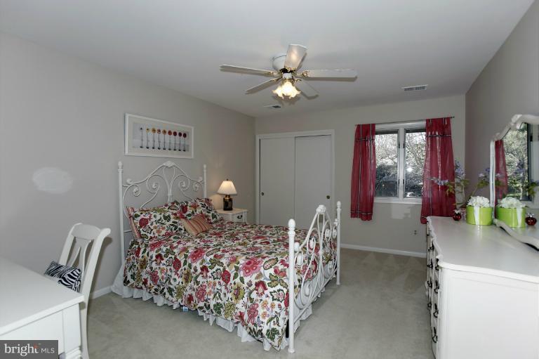 2252 Cedar Cove Court Reston, VA 20191 - Photo 23 of 26 a bed room with bed and a chandelier