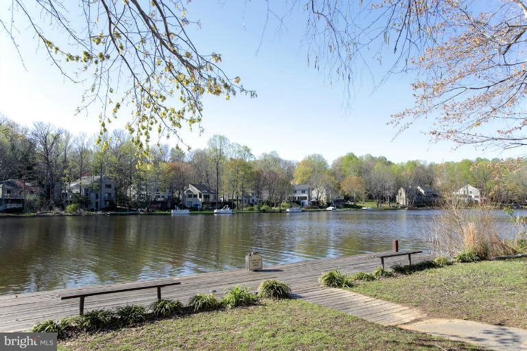 2252 Cedar Cove Court Reston, VA 20191 - Photo 4 of 26 a view of a lake with a mountain in the background