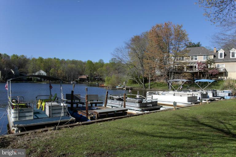 2252 Cedar Cove Court Reston, VA 20191 - Photo 5 of 26 a view of a lake with houses