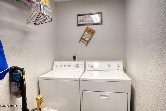 a utility room with dryer and washer