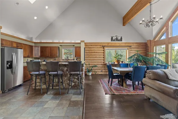 a view of a dining room with furniture window and outside view