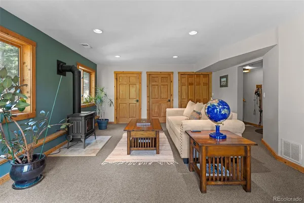 a living room with furniture flowerpot and a window