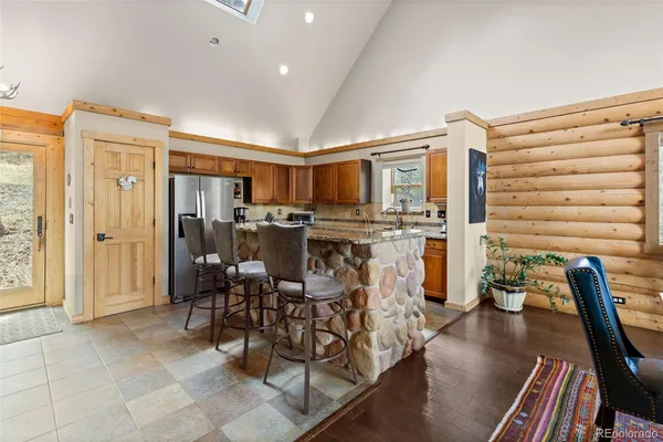 a view of a dining room with furniture window and outside view