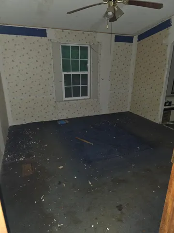 a view of empty room with windows