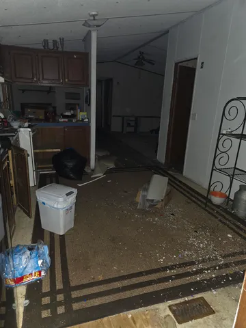 a kitchen with a refrigerator and a sink