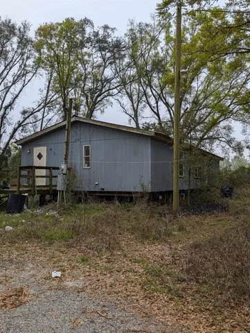 a house view with a backyard space