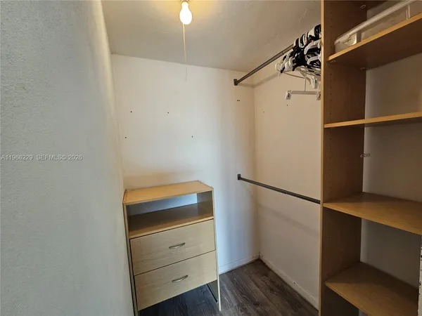 a view of an empty walk in closet