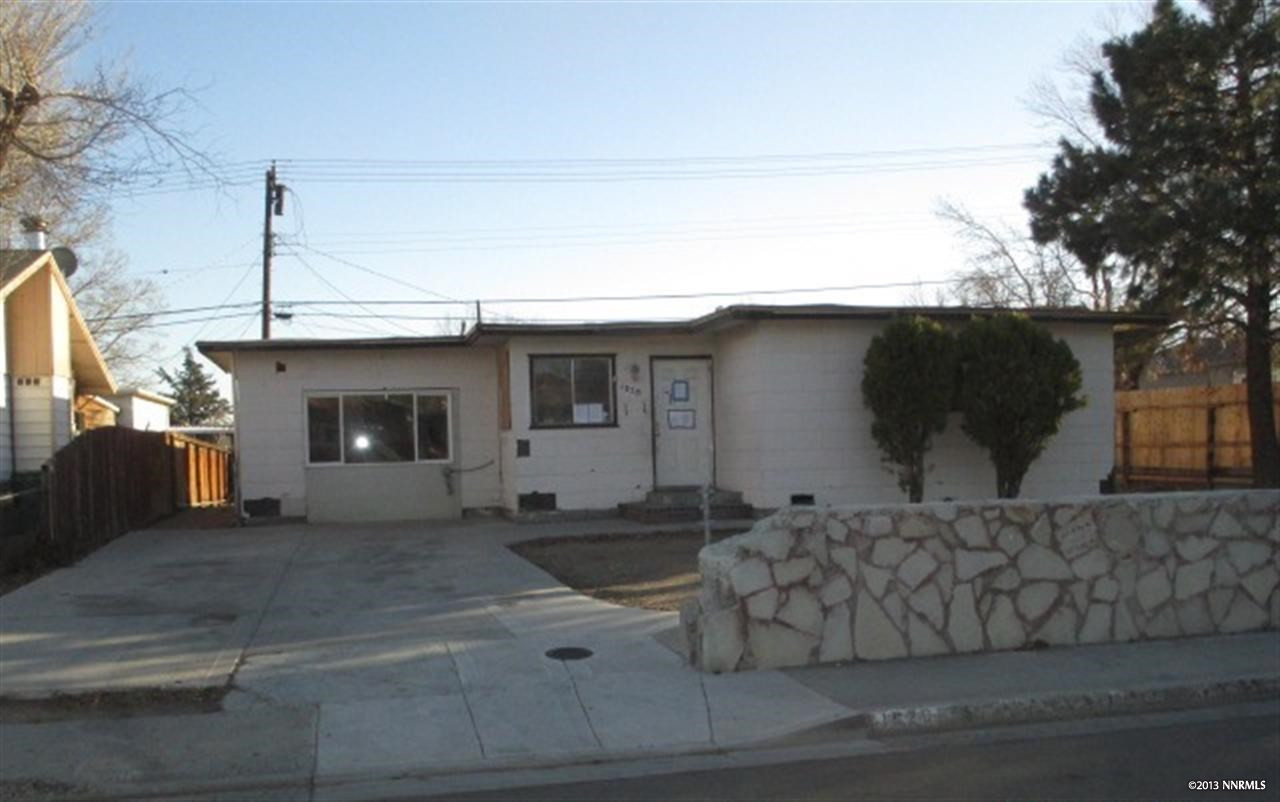 1520 Castle Way Reno, NV 89512 - Photo 1 of 1 a front view of a house with a garage