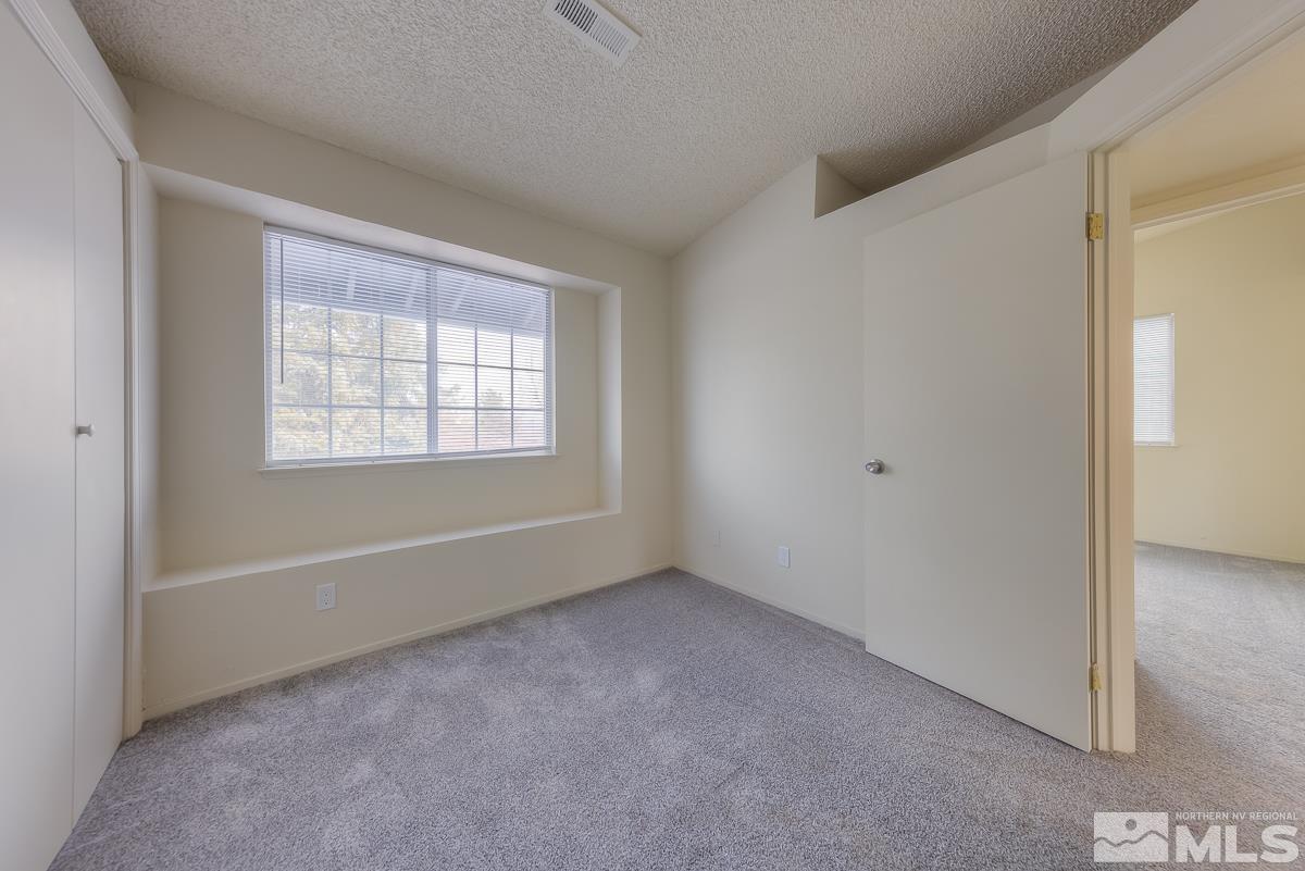 7196 Indigo Circle Reno, NV 89506 - Photo 13 of 33 a view of an empty room with a window