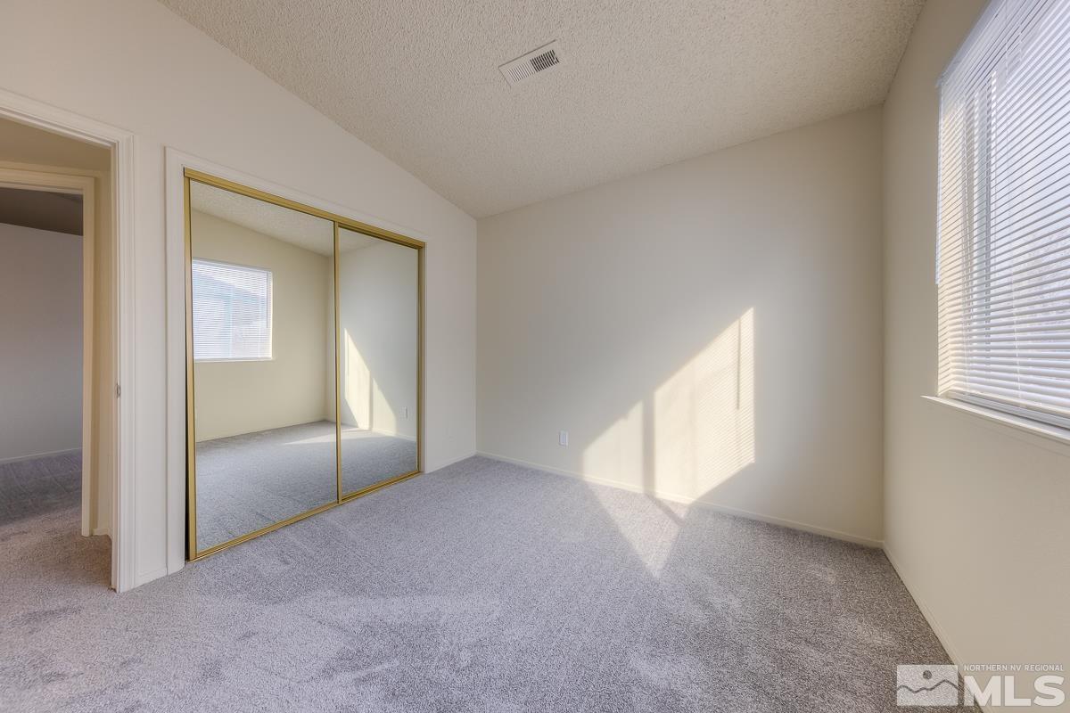 7196 Indigo Circle Reno, NV 89506 - Photo 16 of 33 a view of an empty room with a window