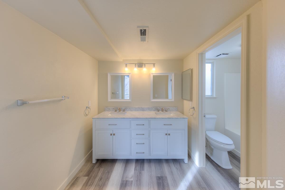 7196 Indigo Circle Reno, NV 89506 - Photo 18 of 33 a view of bathroom with dual sinks