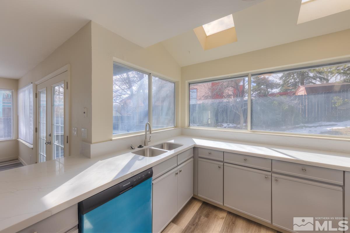 7196 Indigo Circle Reno, NV 89506 - Photo 20 of 33 a kitchen with sink attached with living room