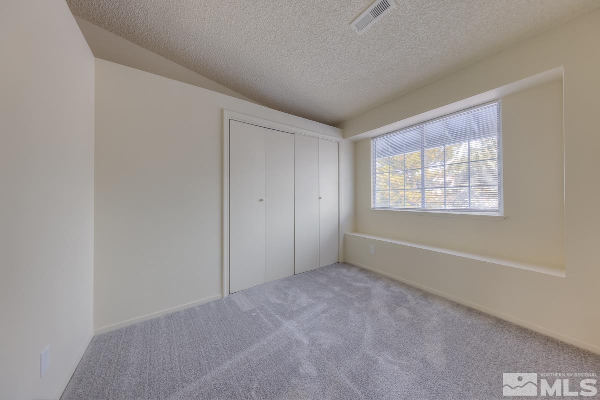 7196 Indigo Circle Reno, NV 89506 - Photo 25 of 33 an empty room with windows