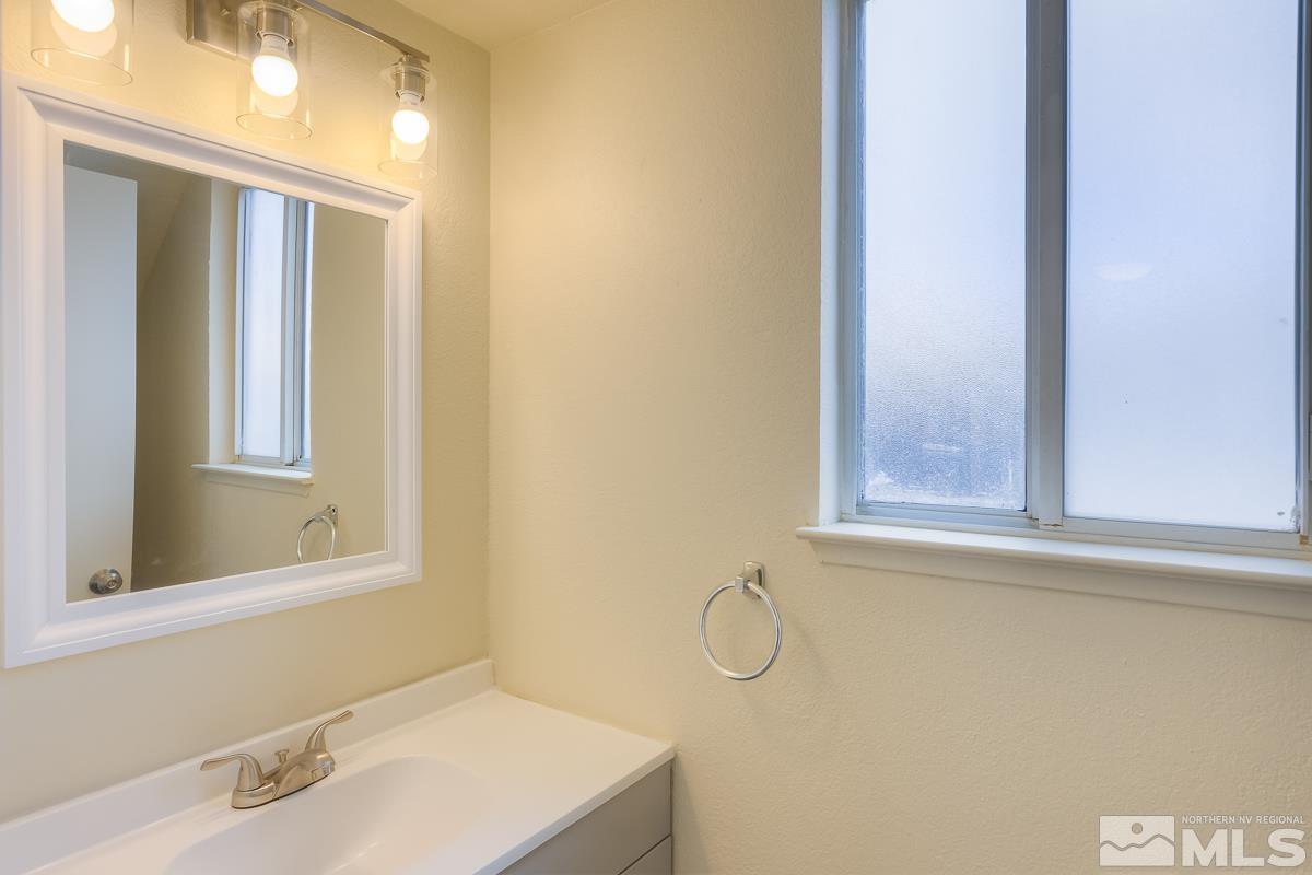 7196 Indigo Circle Reno, NV 89506 - Photo 26 of 33 a bathroom with a sink and a window